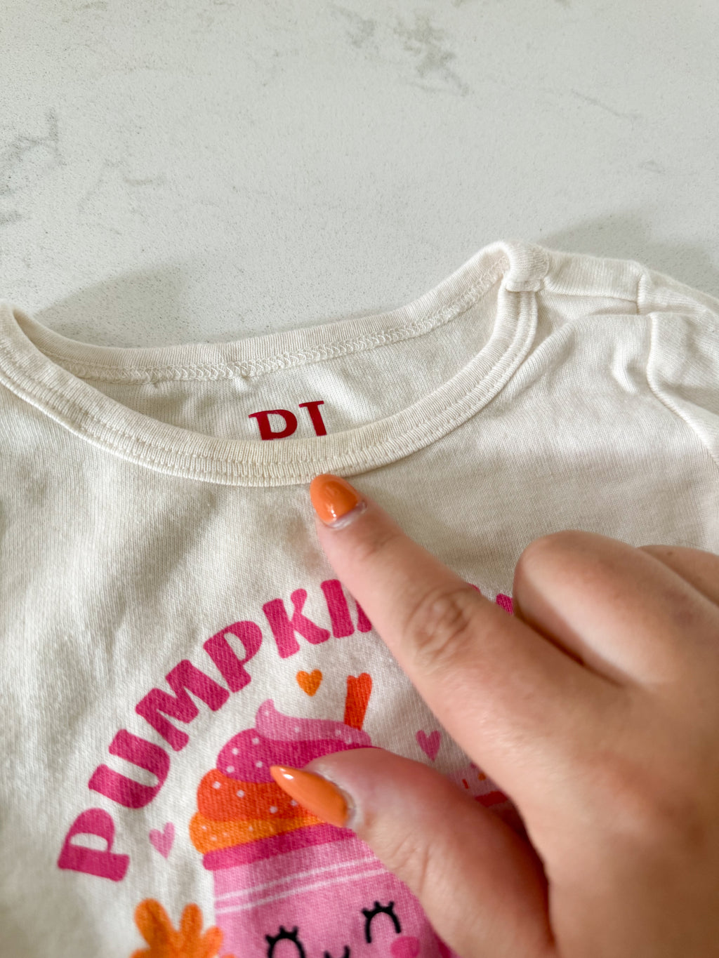The Children’s Place- 9-12m- PLAY- long sleeve white jammies with pink and orange pumpkin spice pattern