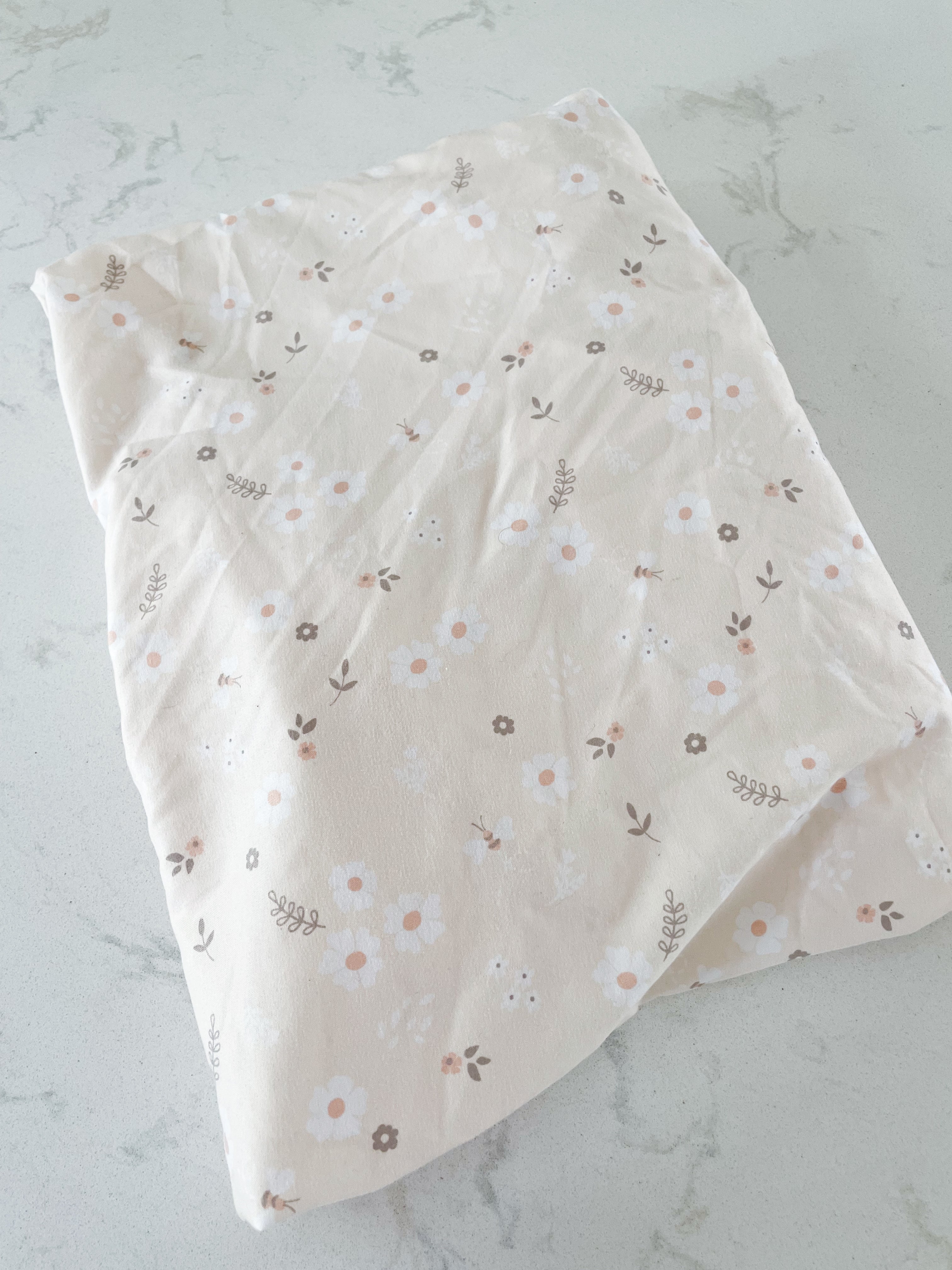No brand- crib sheet- peach with white flowers