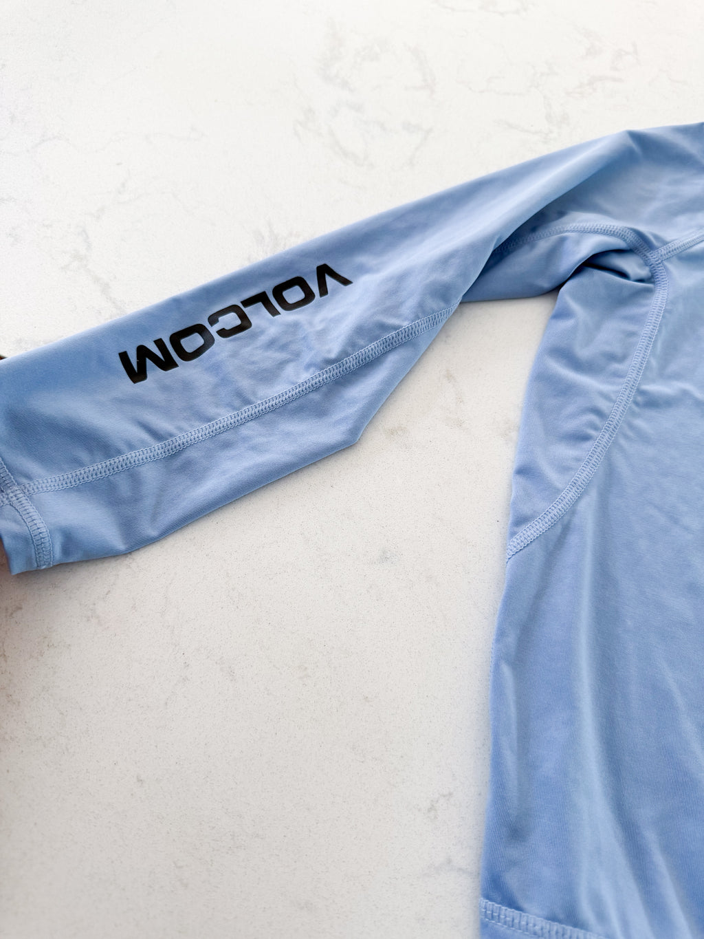 Volcom- 4T- VGUC- light blue thin rashguard with logo on front