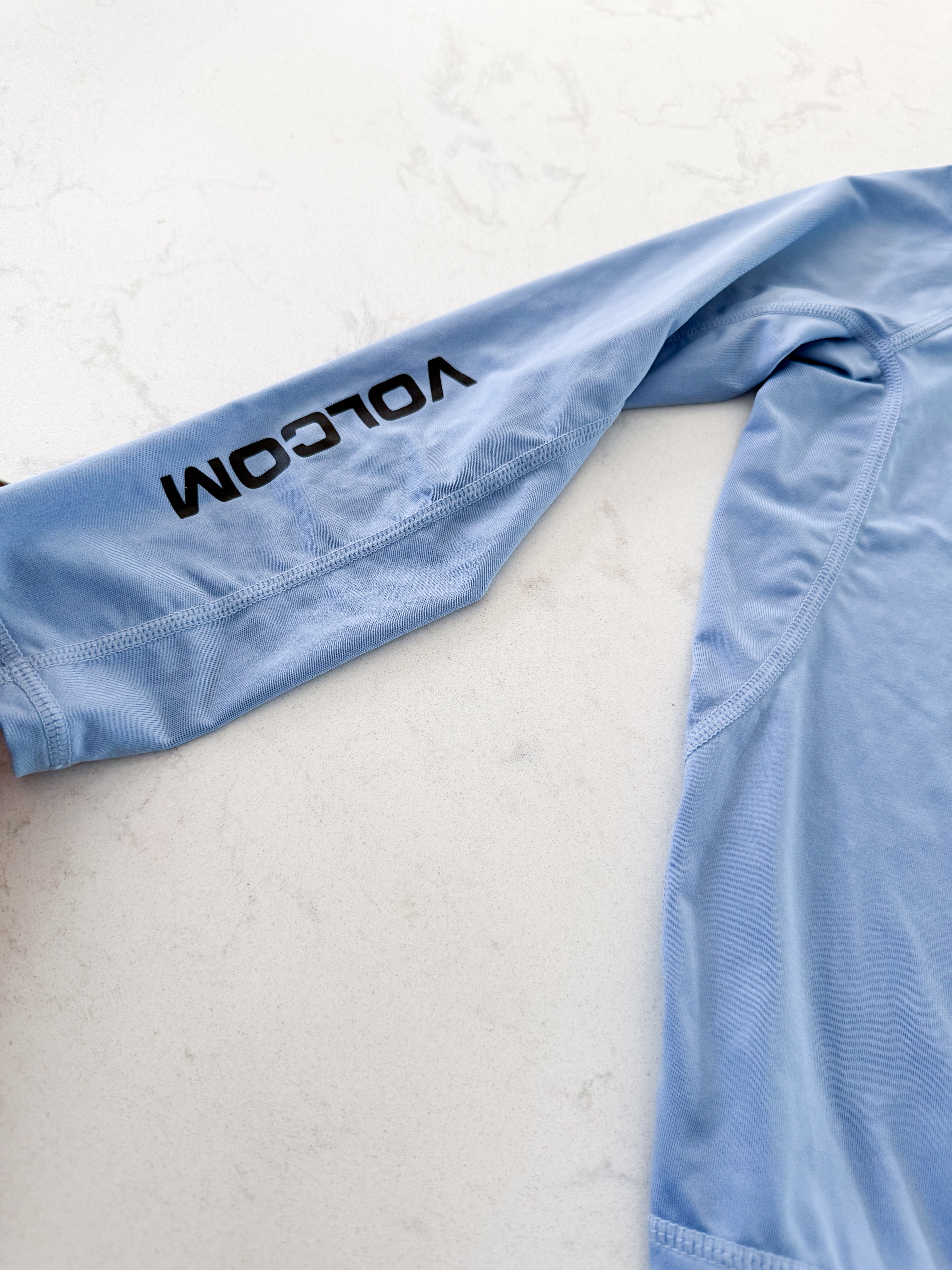 Volcom- 4T- VGUC- light blue thin rashguard with logo on front