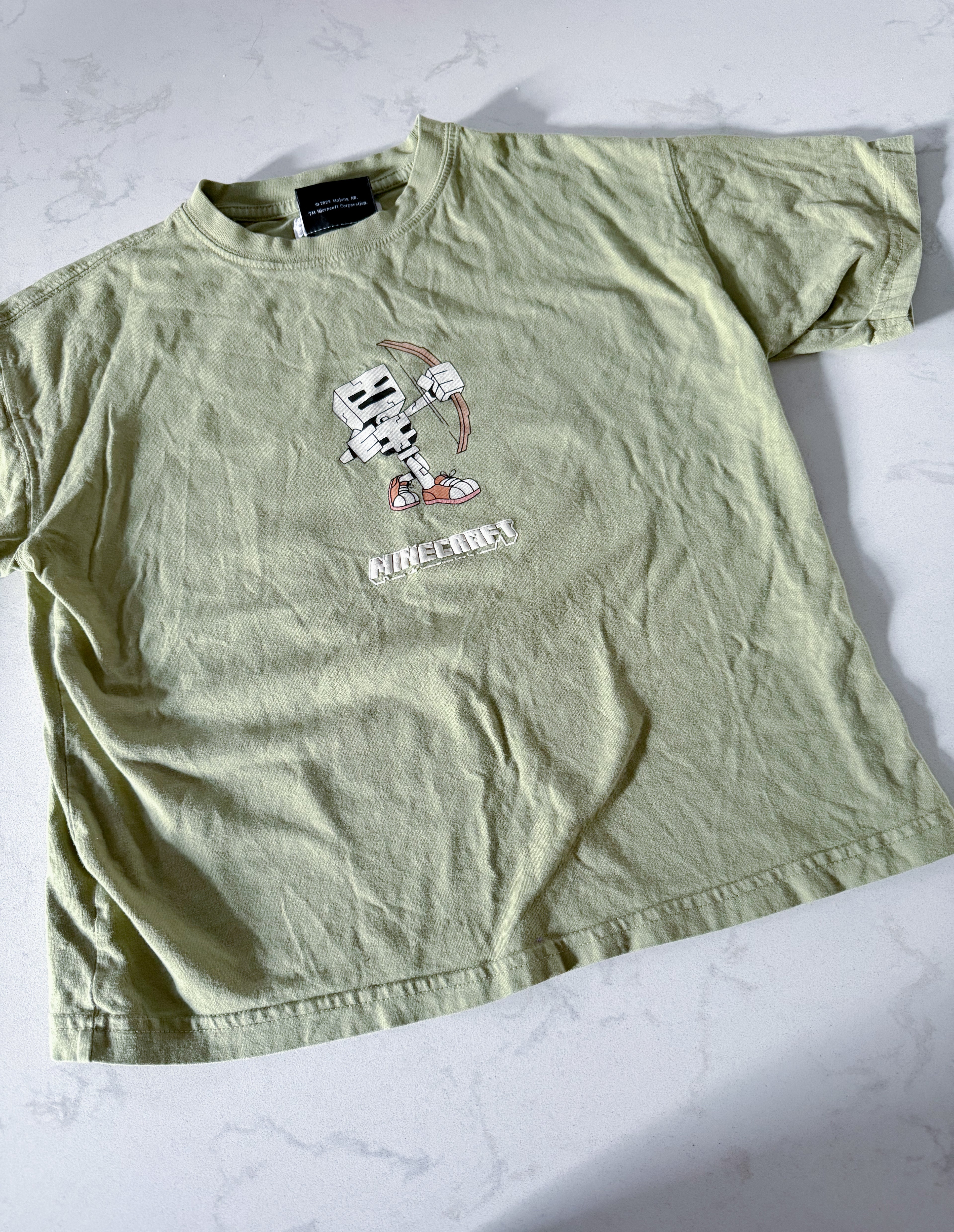 Zara- 8-9Y- GUC- green short t shirt with Minecraft graphics