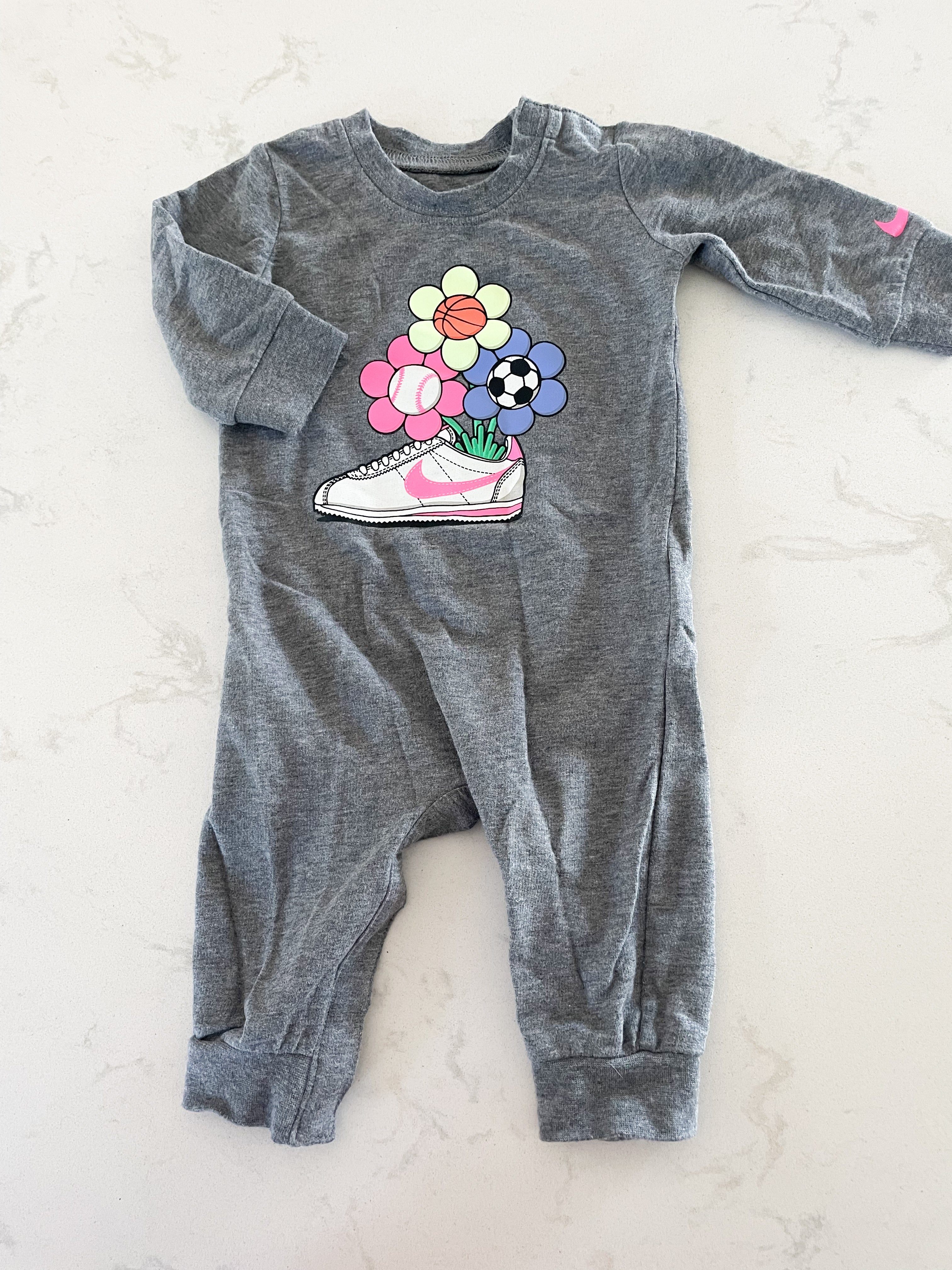 Nike- 6 months- grey romper with neon flowers and shoe graphic