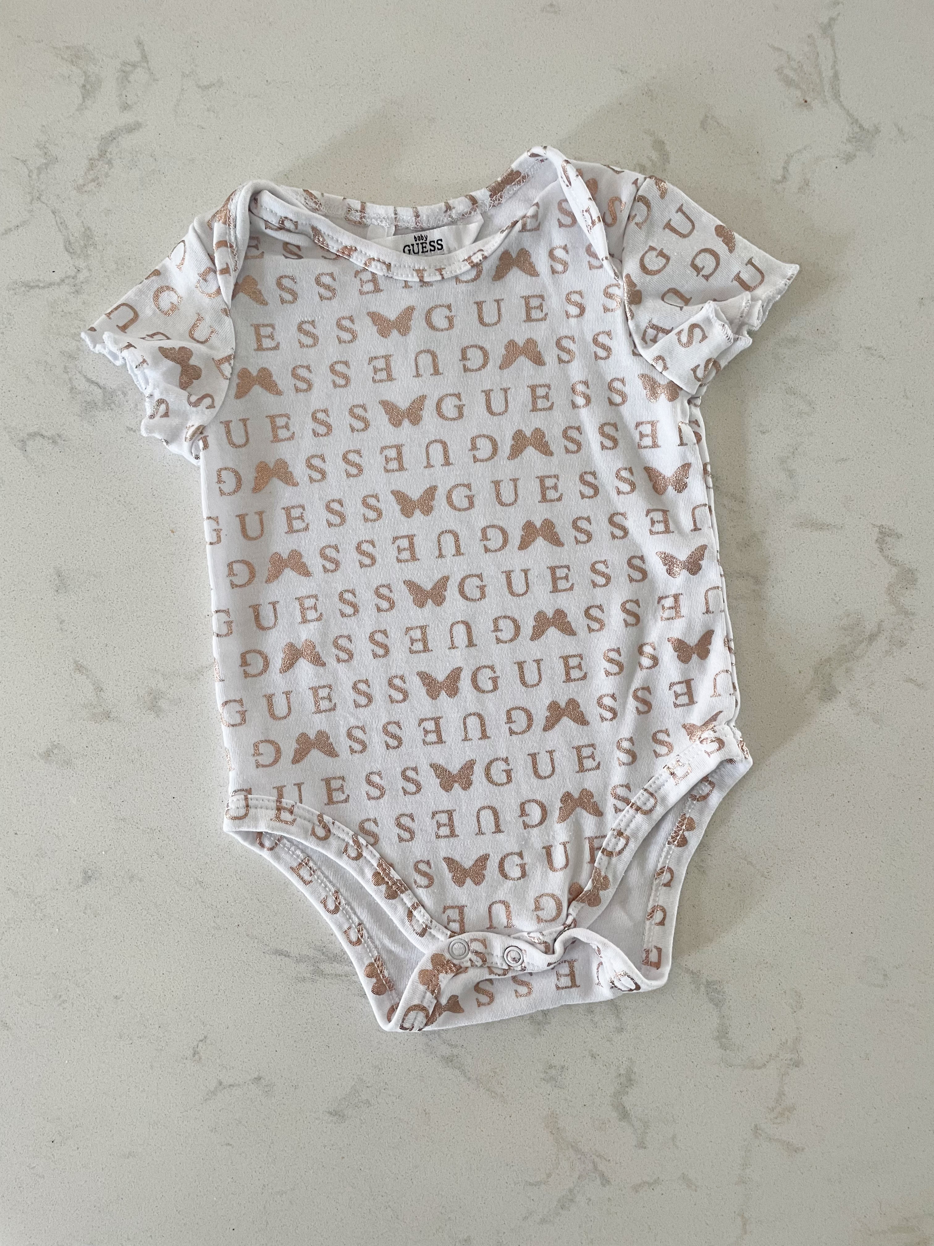 Guess- 3-6 months- white short sleeve bodysuit with metallic rose lettering