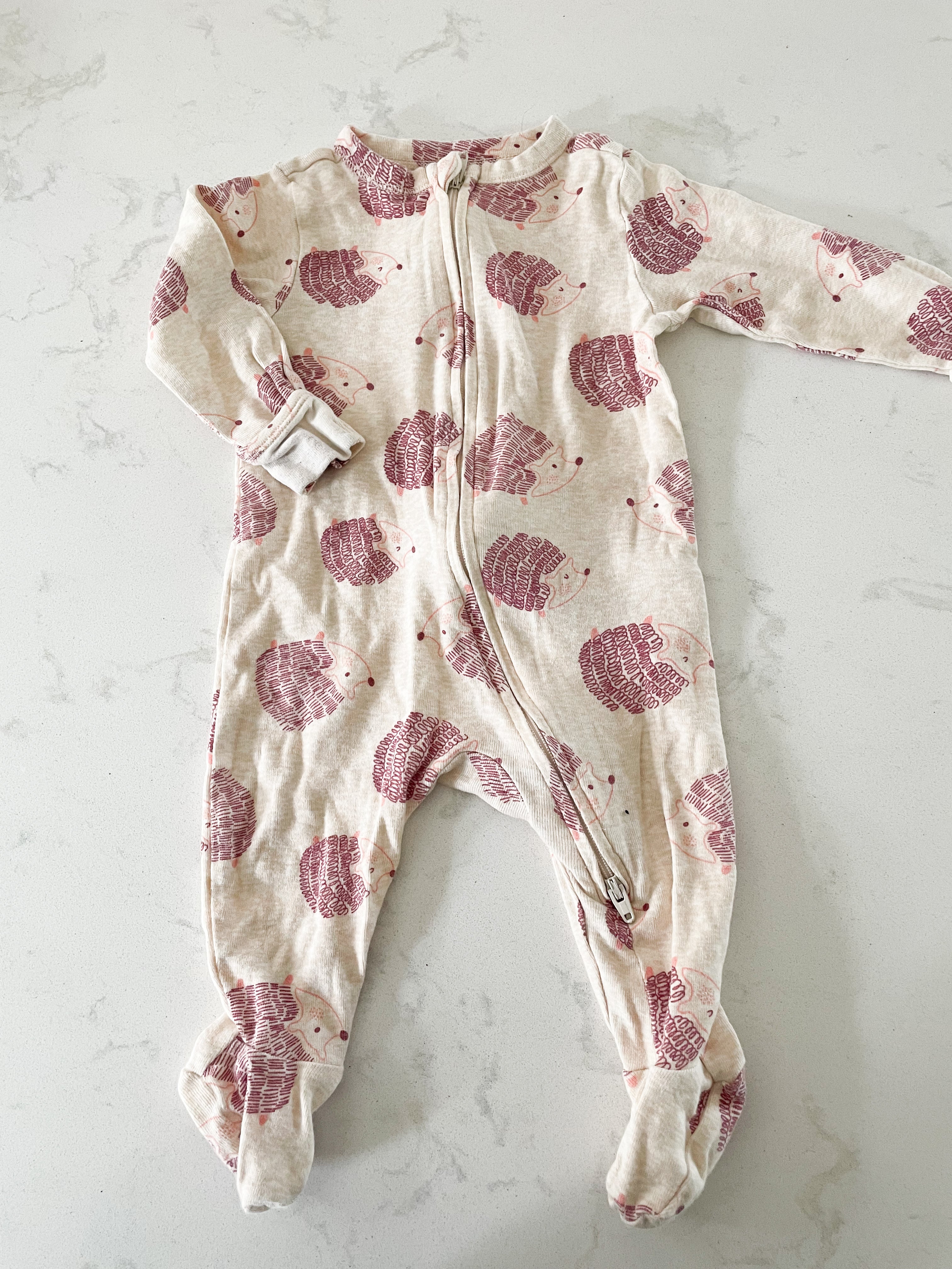 Old Navy- 3-6 months- beige footie pajamas with hedgehogs