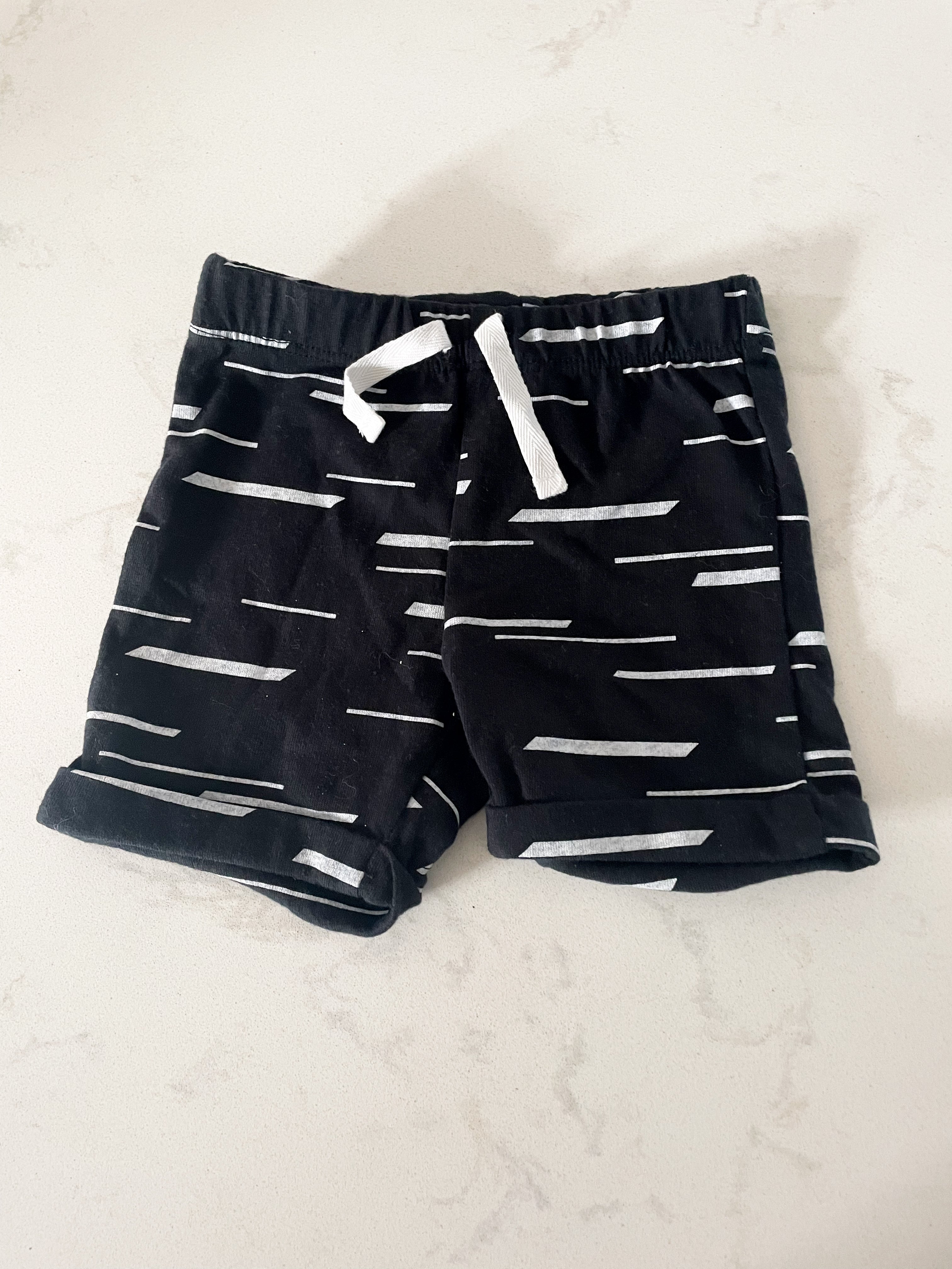 Three Likes- 3 months- black shorts with white dashes