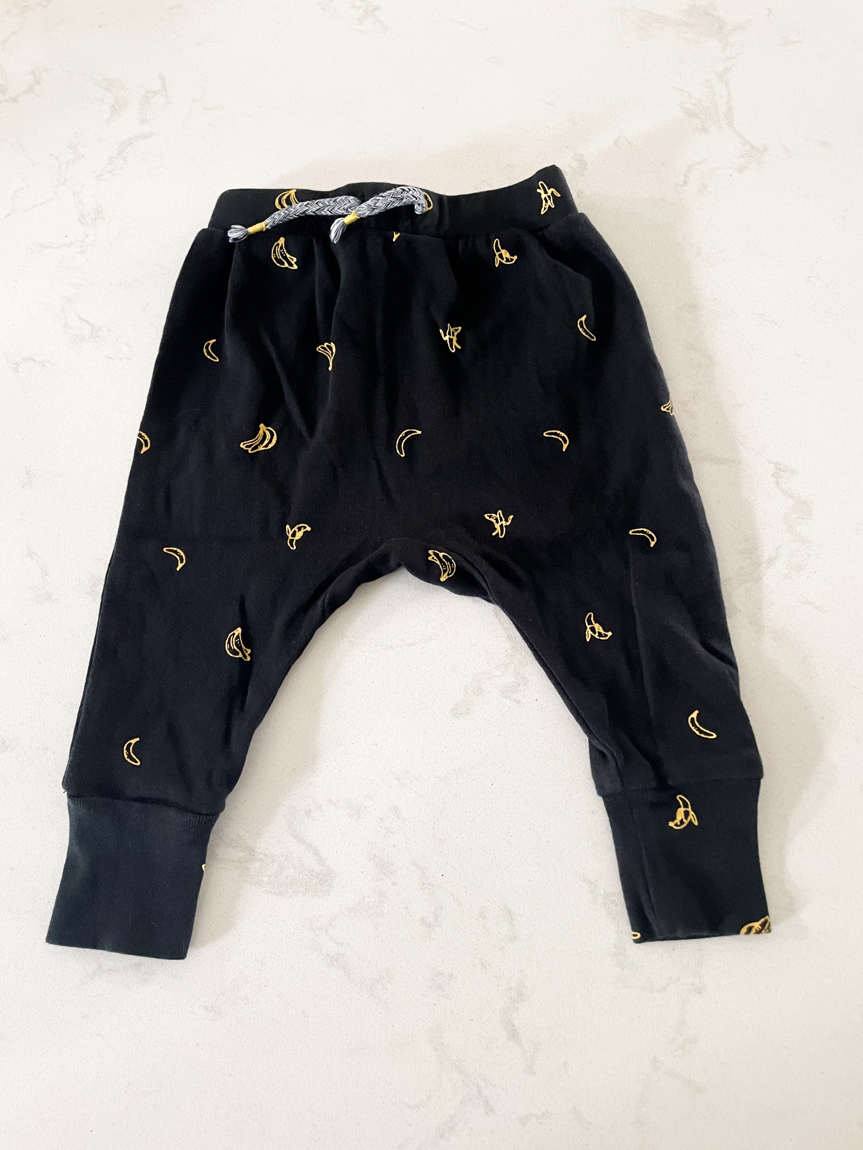 Joe Fresh- 3-6 months- black thin pants with bananas