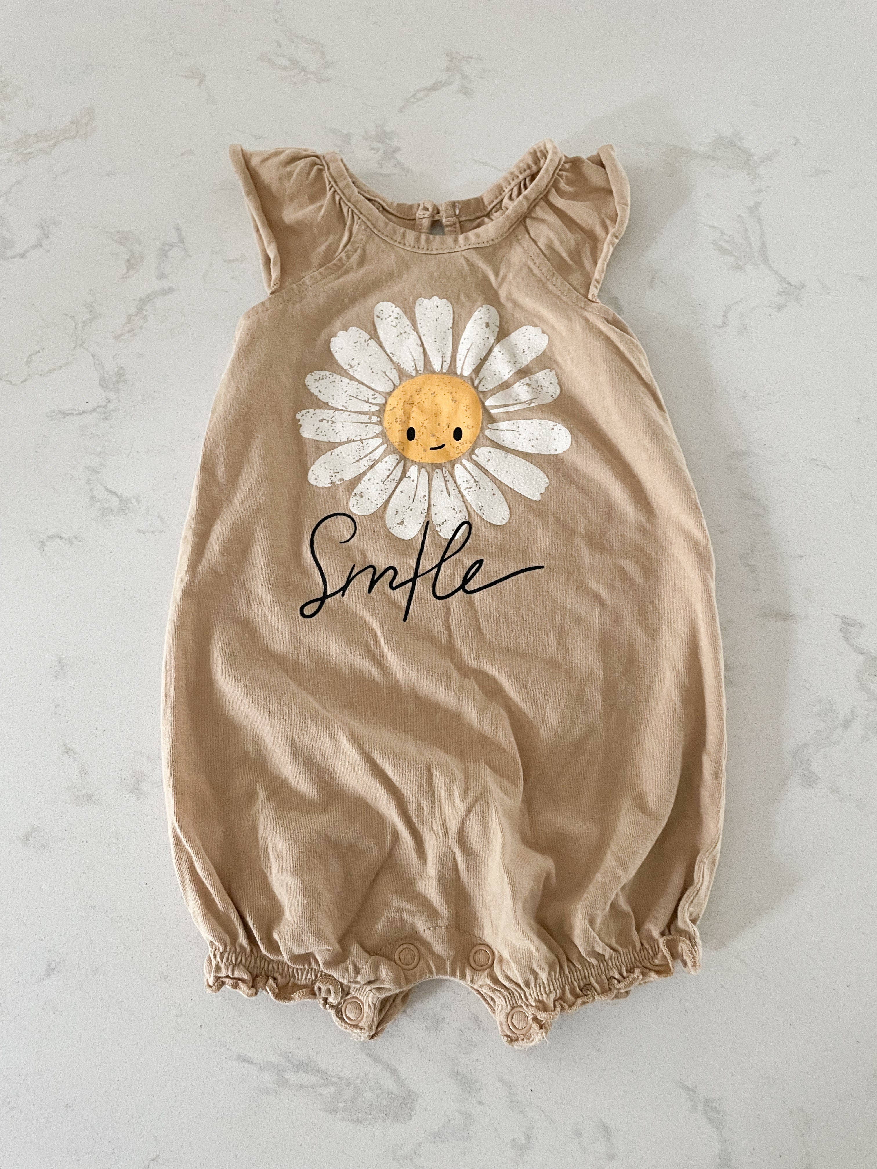 George- 3-6 months- tan shorts romper with smiley daisy