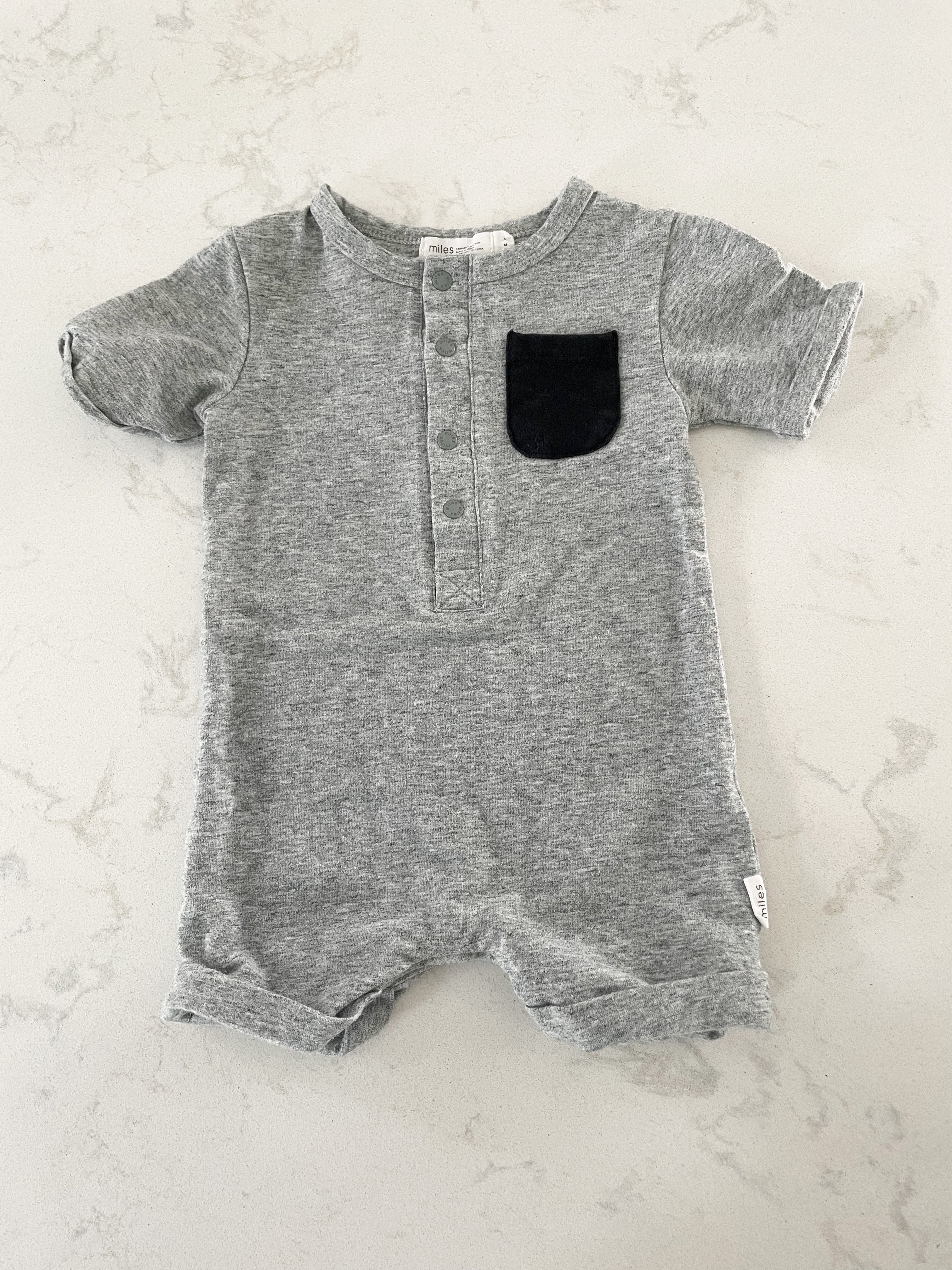 Miles the Label- 3 months- medium grey short romper with black pocket