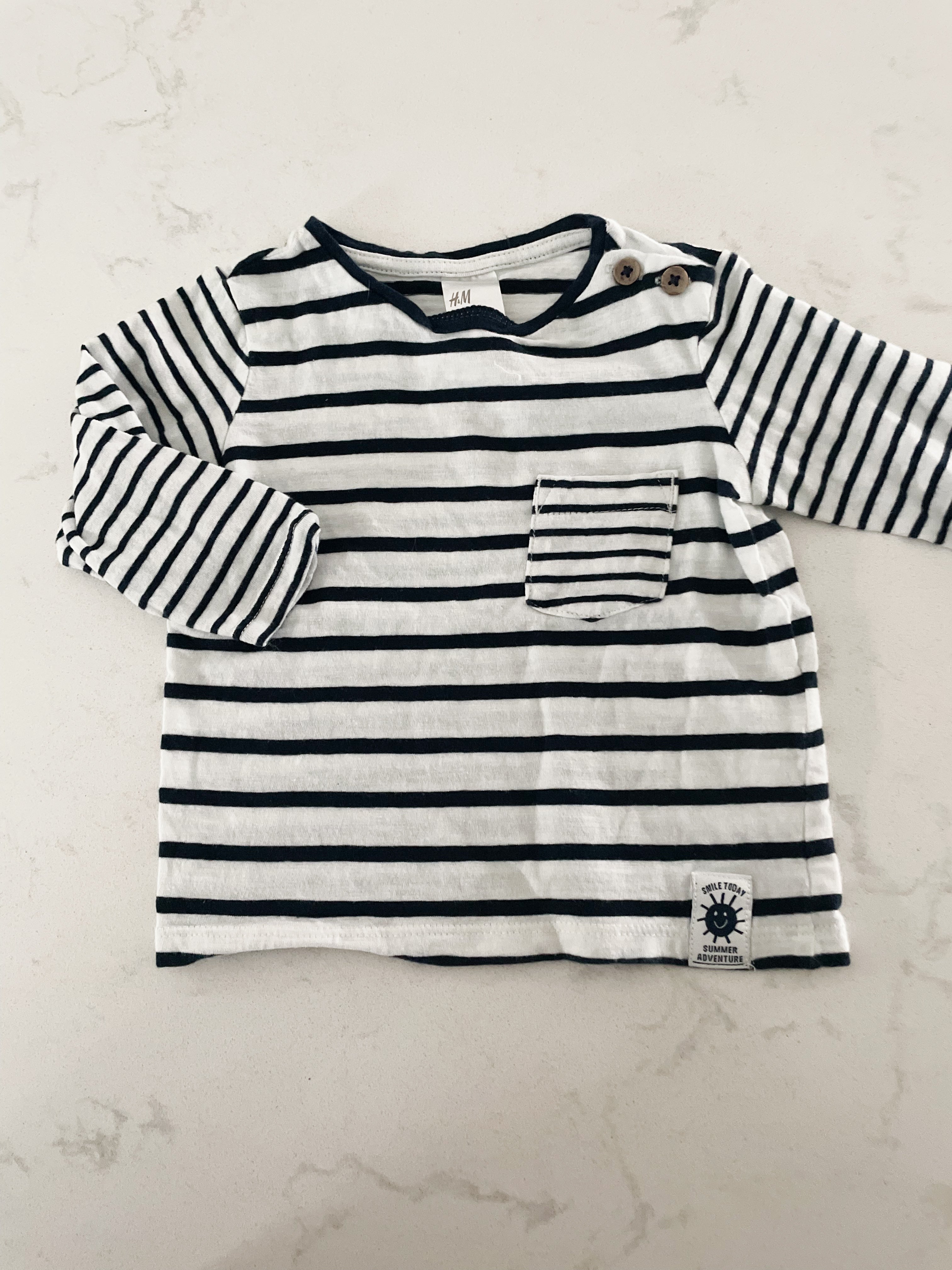H&M- 4-6 months- long sleeve navy and white striped shirt