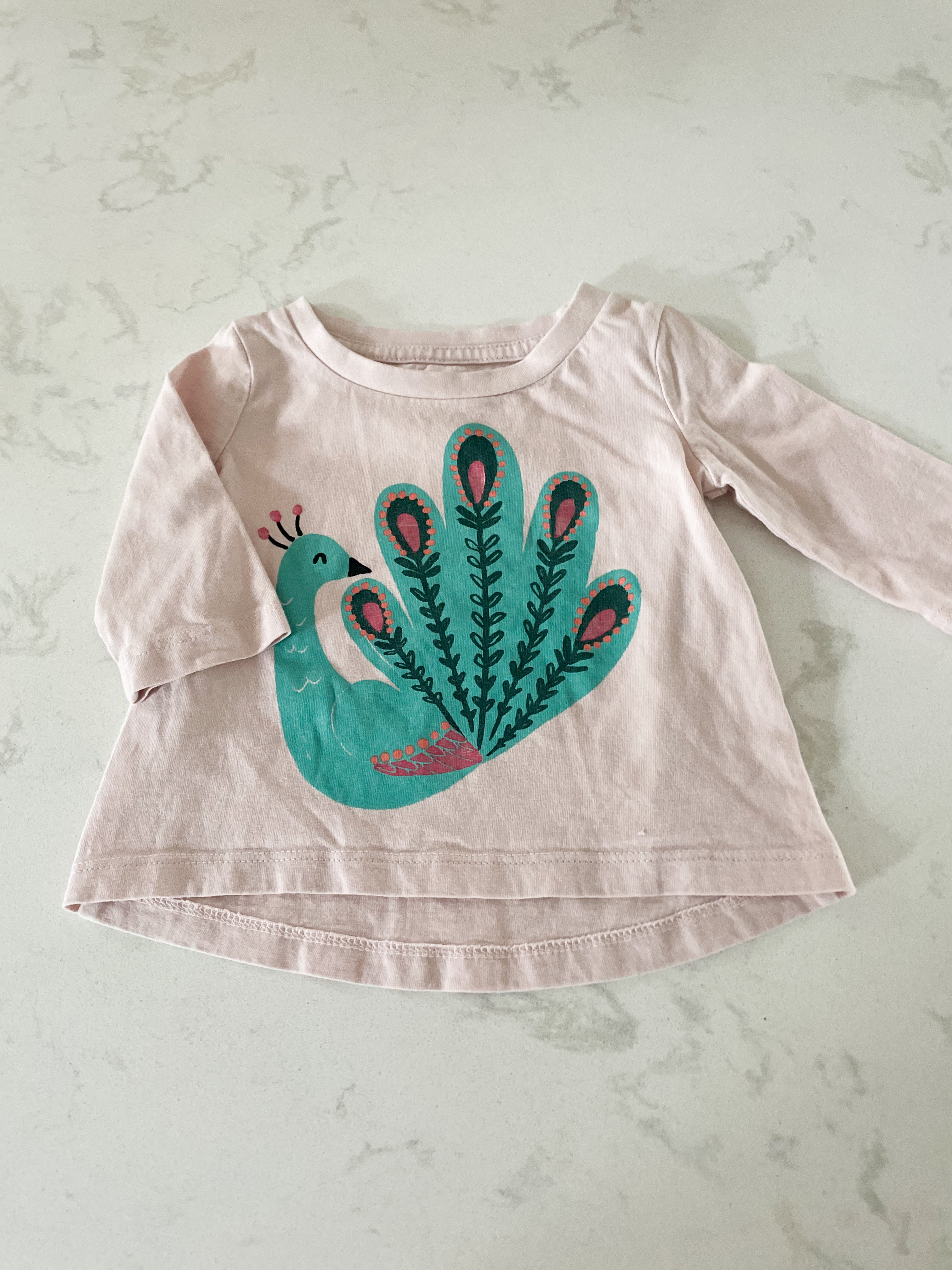 Gymboree- 3-6 months- long sleeve pink shirt with peacock on front