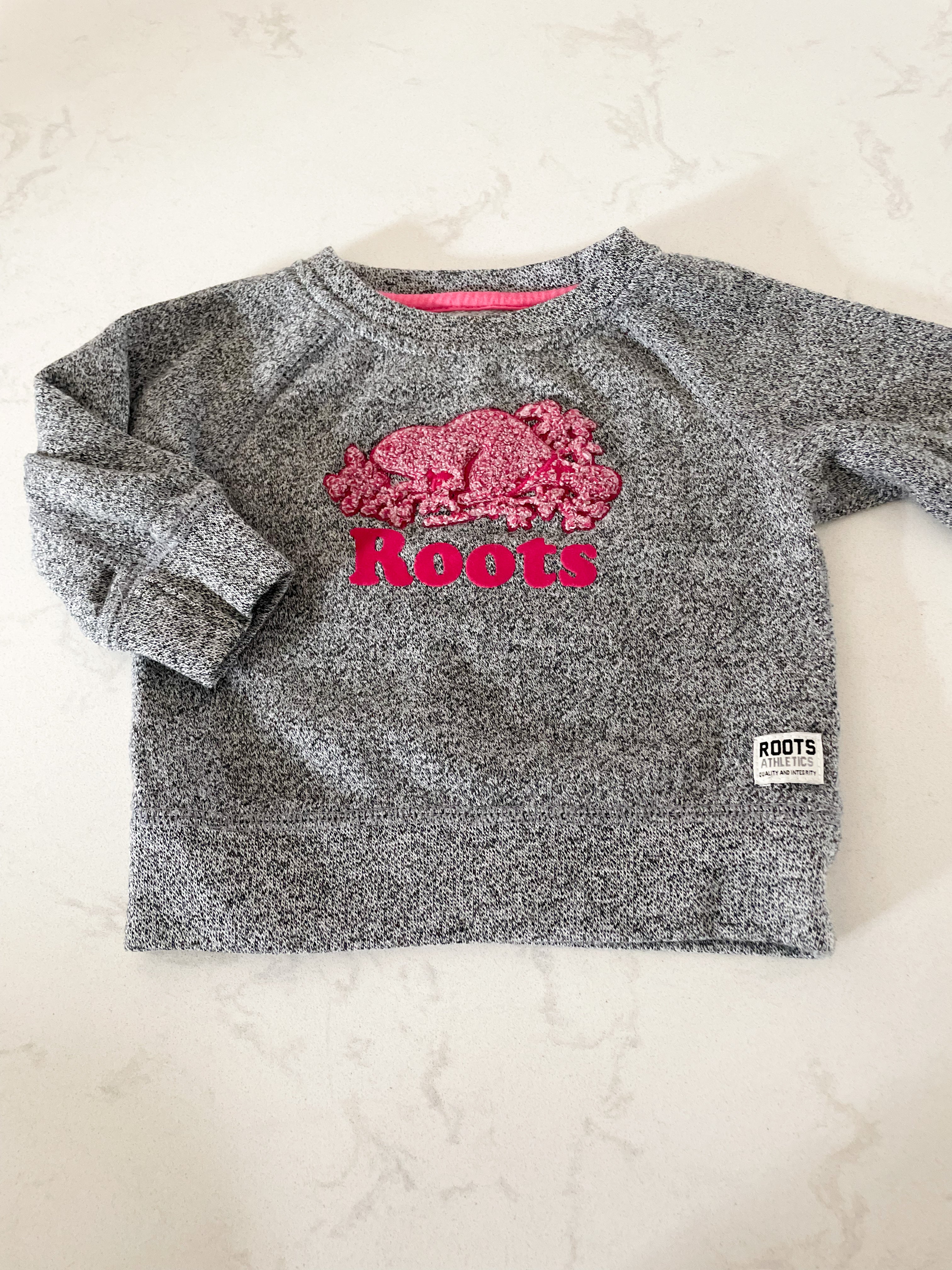 Roots- 3-6 months- grey speckled crew neck with pink logo