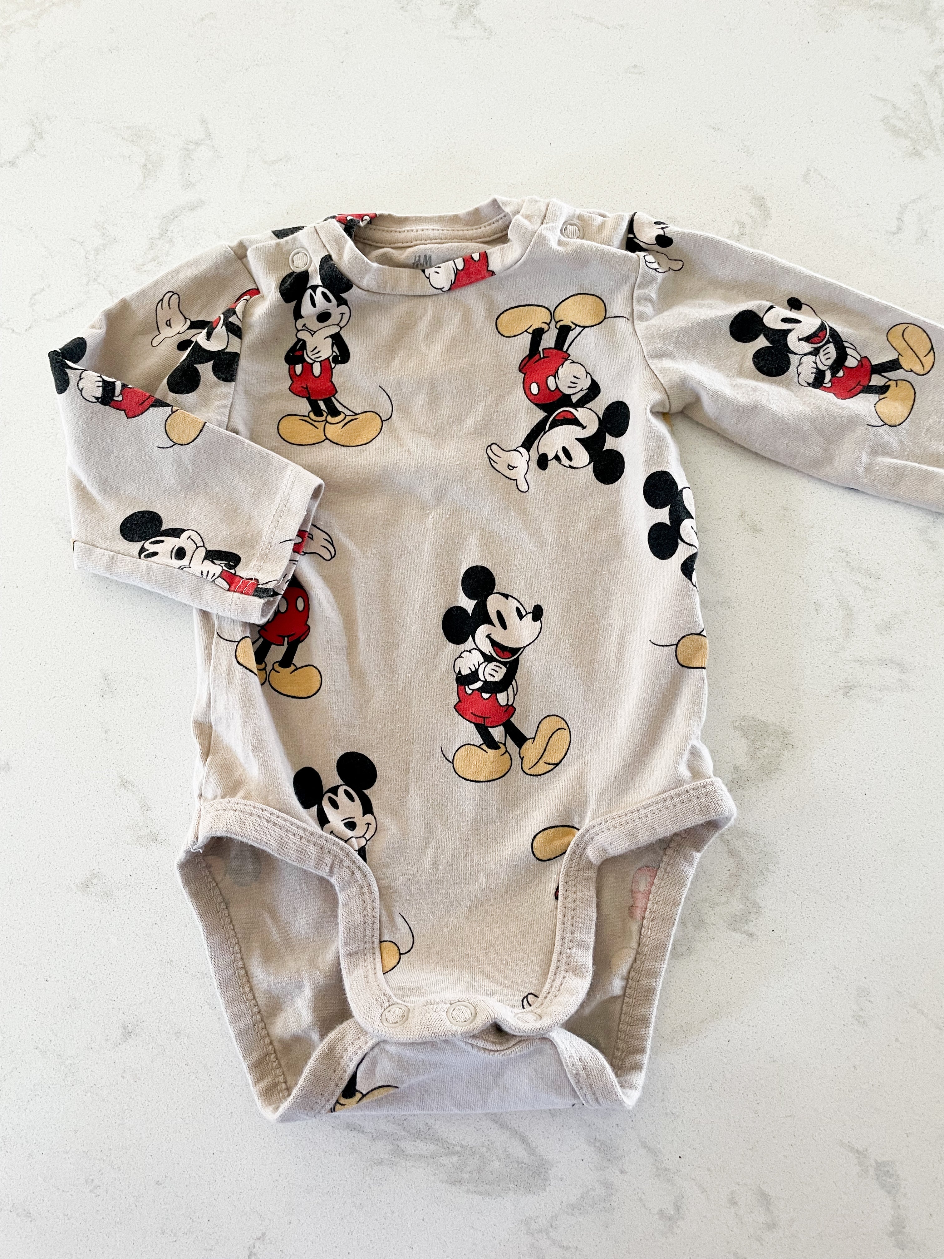 H&M- 3 months- beige long sleeve bodysuit with Mickey